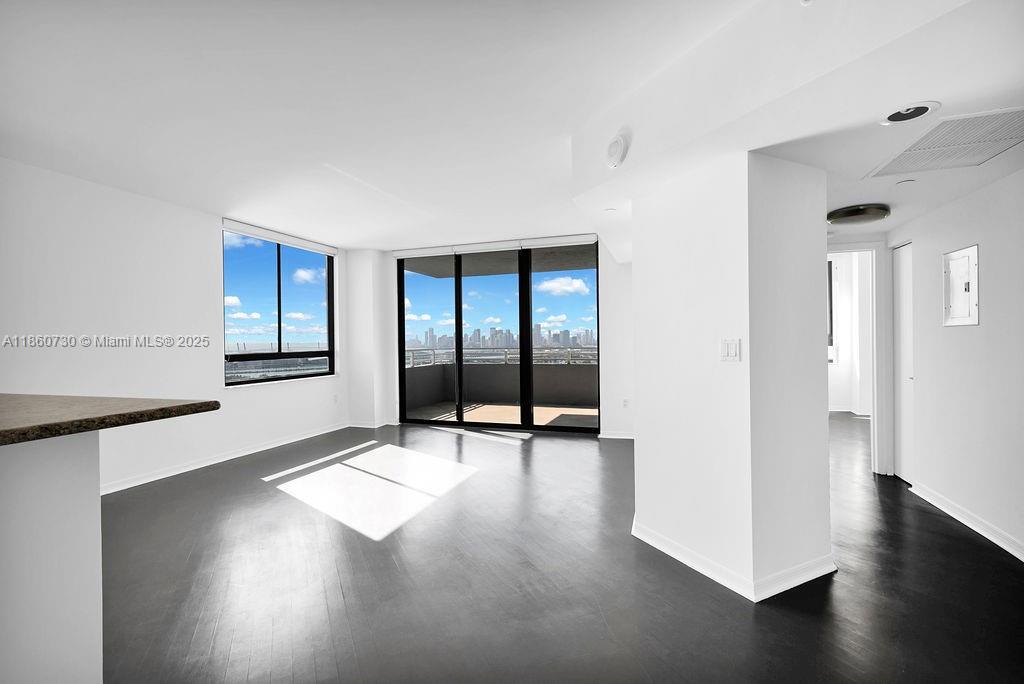 Beautiful Lower Penthouse in The Waverly Condo with Unobstructed Bay and Downtown Views from the 35th Floor. This corner 2 bedroom and 2 bathrooms is in a full-service building. Functional split floor plan with upgraded open kitchen and modern bathrooms with additional closets. The Waverly is known for its' amenities and services. Bayfront heated pool and spa, doorman, gym, tennis court and front desk services.