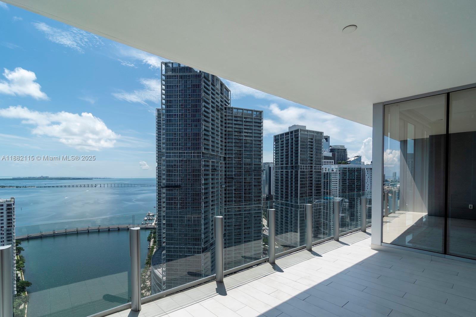 At Aston Martin Residences, Unit 3503 delivers the perfect blend of prestige and lifestyle. This 3-bedroom plus den, 4.5-bath residence includes a family room and staff quarters, all finished with white marble floors, Artefacto furnishings, and Ornare closets. Expansive windows capture stunning views of the Miami River and Brickell Key, while the chef’s kitchen with top-tier appliances enhances its appeal. With 42,000 sq ft of amenities—sky-high pool, luxury spa, fitness center, private theaters—this building is a destination in itself. Located in Downtown Miami, it offers unbeatable value for clients seeking luxury and exclusivity.