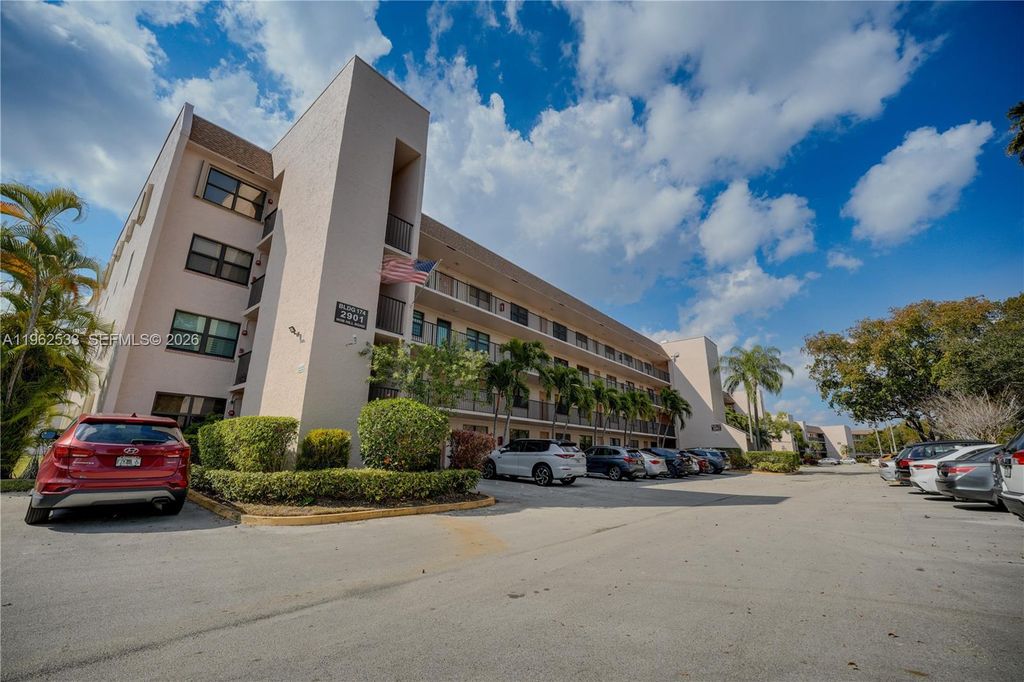 Photo of 2901 N Nob Hill Rd #303, Sunrise, FL 33322 (MLS # A11962533)