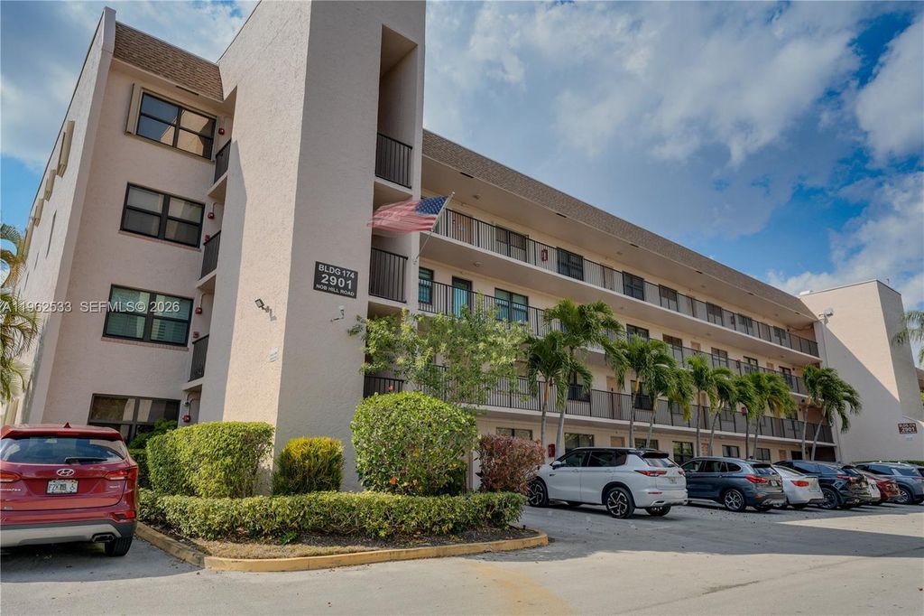 Photo of 2901 N Nob Hill Rd #303, Sunrise, FL 33322 (MLS # A11962533)