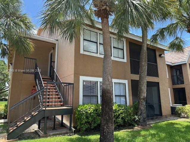 Beautiful Move-In ready, freshly painted interior 2 bedroom, 2 bath condo. Spacious kitchen with espresso tone cabinets, granite counter tops, breakfast bar area and full appliances. Neutral tone tile floors throughout living area and wood floors in bedrooms. Large master bedroom with walk in closet. Open balcony area to enjoy the upcoming fall weather. This unit comes complete with an interior laundry room that includes a washer and dryer. Located in the wonderful community of the Hammocks, close to A rated schools, transportation, shopping, restaurants and so much more! Pet friendly community with restrictions.
