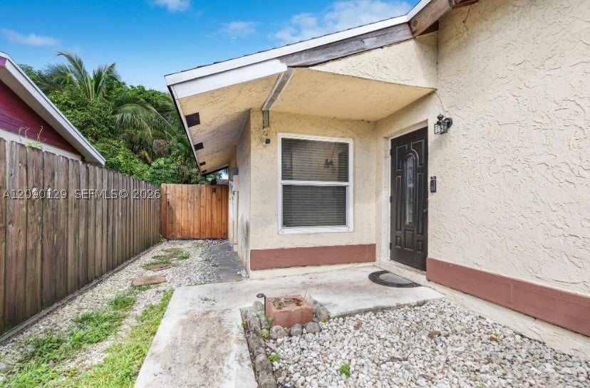 Photo of 281 SW 83rd Ave, North Lauderdale, FL 33068 (MLS # A12090129)