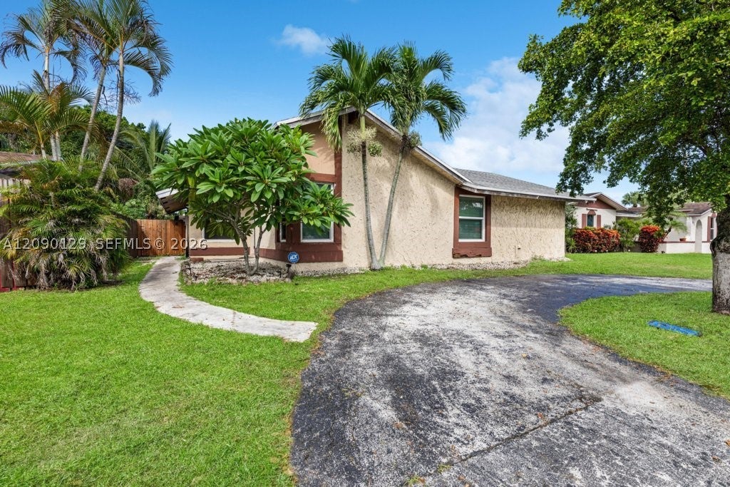 Photo of 281 SW 83rd Ave, North Lauderdale, FL 33068 (MLS # A12090129)