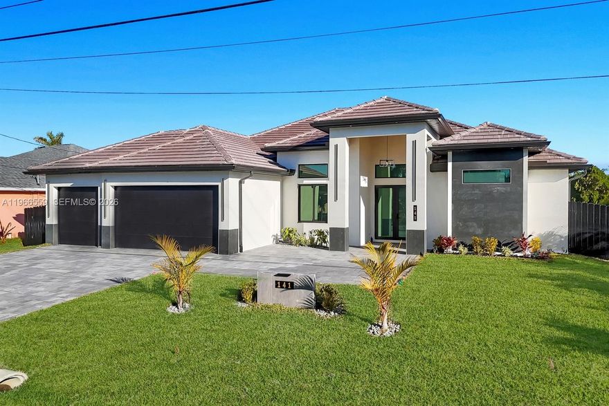 Welcome to this modern waterfront luxury home that features 4BED, 3BATH residence with a 3 car garage and over 2,200sqft of refined living space, ideally located in one of Cape Coral’s most desirable waterfront neighborhoods. Designed for comfort, efficiency, and style, the home features soaring 13 foot ceilings, 40x40 thick Spanish matte tile flooring throughout, and a durable tile roof, all complemented by abundant natural light and expansive water views of a 125-foot-wide canal with seawall and concrete built in sitting area overlooking waterfront views perfect for entertaining and bbqs. The open concept layout centers around a chef’s kitchen equipped with Samsung’s newest suite of smart appliances, built-in microwave/oven combo, and Wi-Fi connectivity, home prewired ready to install security cameras. Outdoor living shines on the expansive lanai with a fully equipped Florida kitchen and dual grill setups overlooking a private 15x30 heated saltwater pool, perfect for year round enjoyment. Seamless elegant inspired bathrooms features smart toilets, a fully automated sprinkler system, and an EcoSmart tankless water heater. All city water and sewer assessments are paid in full, adding significant value, and the home’s prime location offers peaceful waterfront living just minutes from shopping, dining, and everyday conveniences making this thoughtfully designed property ideal as a full time residence or luxury vacation retreat.