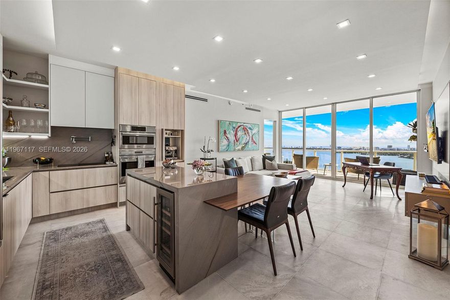 Fully remodeled 2-bed, 2.5-bath residence at Paramount Bay with two private balconies showcasing unobstructed Biscayne Bay and city views. This elevated residence features Calacatta marble floors, custom kitchen with floor to ceiling cabinets, premium appliances and wine cooler, fully renovated bathrooms and walk-in closets, custom built-ins, automated shades, as well as new custom doors and balcony flooring. Additional highlights include a large sized den, private foyer, laundry room, 2 parking spaces, and storage space. Residents enjoy resort-style amenities including sunrise and sunset pools, spa, fitness center, theater, BBQ area, game room, club room, and full-service concierge. Situated in Miami's Edgewater, steps from dining, shopping, entertainment, and Margaret Pace Park, with easy access to Miami Beach and Downtown.