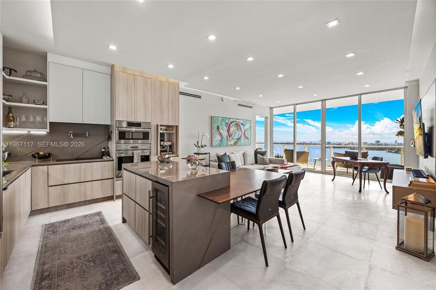 Fully remodeled 2-bed, 2.5-bath residence at Paramount Bay with two private balconies showcasing unobstructed Biscayne Bay and city views. This elevated residence features Calacatta marble floors, custom kitchen with floor to ceiling cabinets, premium appliances and wine cooler, tastefully renovated bathrooms and walk-in closets, custom built-ins, automated shades, as well as new custom doors and balcony flooring. Additional highlights include a large sized den, private foyer, laundry room, 2 parking spaces, and storage space. Residents enjoy resort-style amenities including sunrise and sunset pools, spa, fitness center, theater, BBQ area, game room, club room, and full-service concierge. Situated in Miami's Edgewater, steps from dining, shopping, entertainment, and Margaret Pace Park, with easy access to Miami Beach and Downtown.