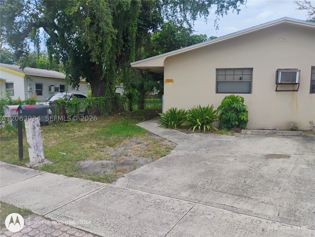 Photo of 26 SW 6th Ave #1-2, Dania Beach, FL 33004 (MLS # A12063034)