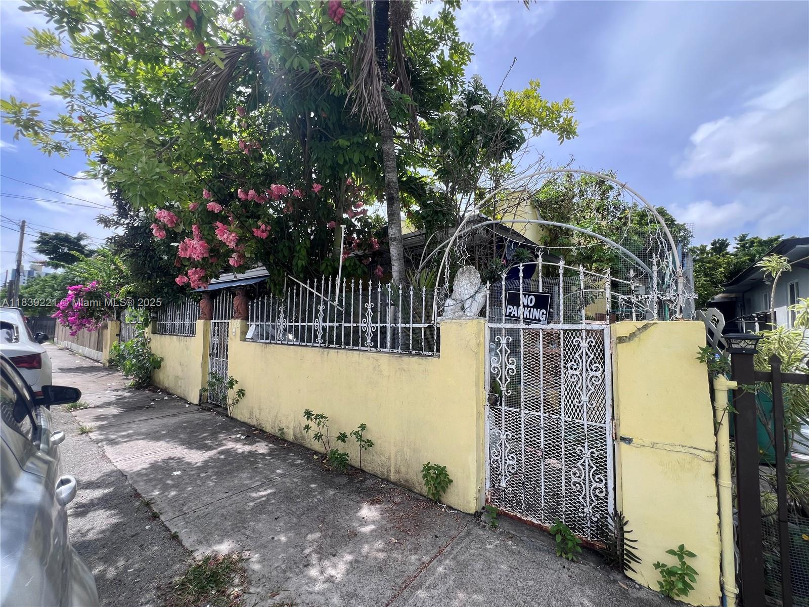 Investor special! Original home is 2 beds, 3 baths with unpermitted additions including 3 extra bedrooms, 1 full bath, and 2 half baths. Property has violations and city fees due to non-permitted work. Roof is over 20 years old. Features tile floors, some impact windows, flat roofs, and multiple living areas. Certain appliances will not convey. Being sold as-is. Great opportunity for investors to bring value to a centrally located Miami property. Please do not disturb occupants.