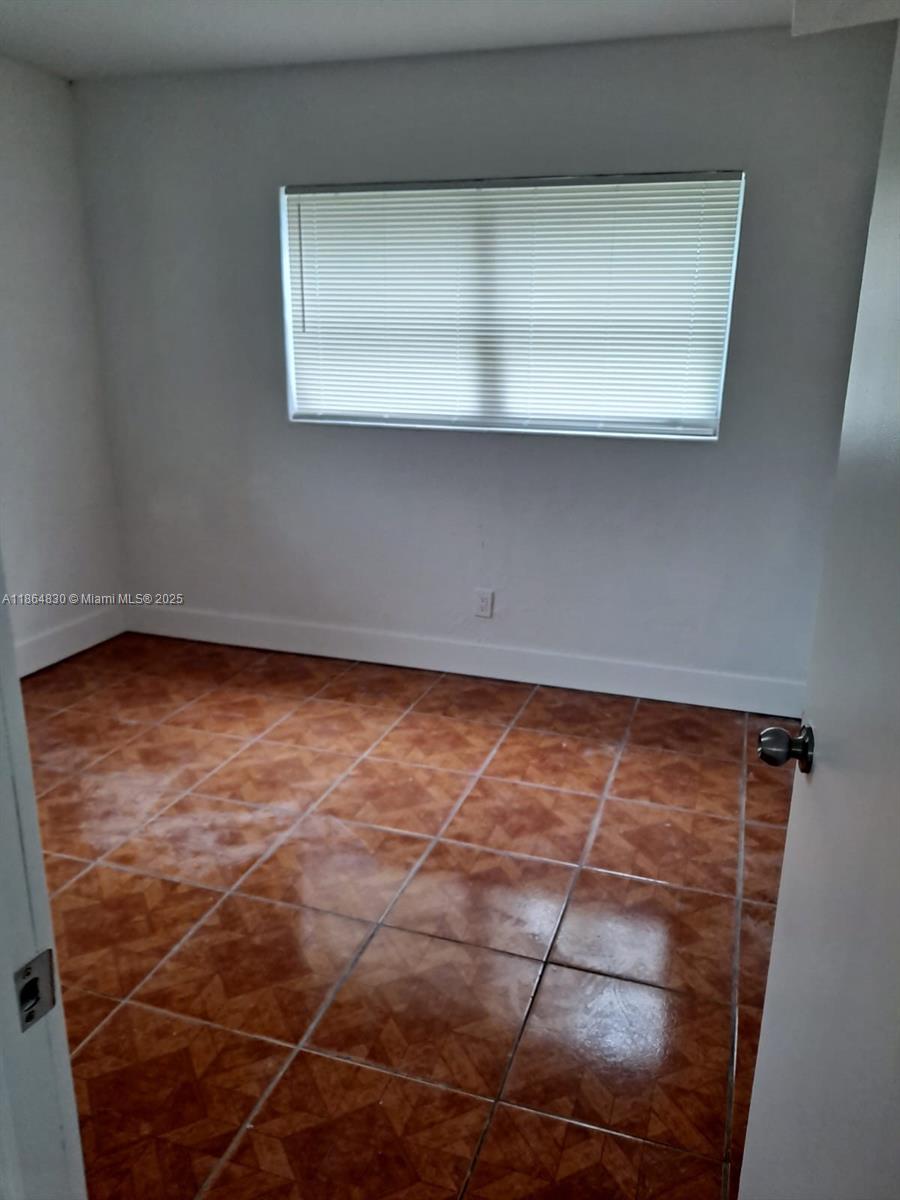 2-bedroom, 1-bath home in Miramar. Features include tile flooring, open living area, and a comfortable layout. The property offers a spacious yard and convenient location near major roads, schools, and shopping. Easy to show.