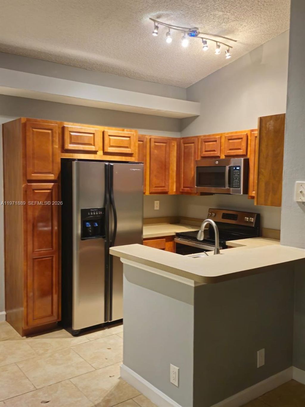 Photo of 701 Lyons Rd #13205, Coconut Creek, FL 33063 (MLS # A11971889)