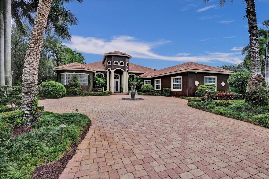 Blackhawk Reserve’s gated enclave of 42 estates holds this single-story custom home on corner builder’s acre. Triple-split layout offers 5 ensuite bedroom, grand owner suite, office, and theater (5th BD). Volume coffered ceilings, Italian marble floors, and abundant light set an elegant tone. Chef’s kitchen features center island, granite, new refrigerator, new double ovens, and an 8 burner gas range with grill. Outside, enjoy fenced yard with 60×20 heated pool, Viking grill, fire pit, lush landscaping, and lake view. Full-impact glass, motorized shades, Sonos, Crestron, dual driveways, 3 car garage, and wiring for whole-house generator complete the package. Community has no separate HOA fee—management and common area costs are collected through CDD and included in annual property taxes.