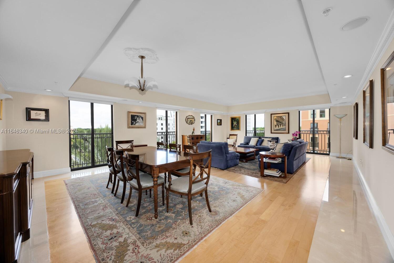 This is the largest apartment in a very private boutique building, offering 2,810 square feet (as per the owner's survey). Custom-designed exclusively for the owner, it features crown molding, marble and wood floors, and spacious closets and bathrooms in each of the three bedrooms. This apartment, maintained in impeccable condition as a second home, is bathed in natural light with floor-to-ceiling impact windows and occupies two corners of the building. Enjoy delightful sunrise views from the great room, along with city and golf course vistas. Conveniently located within walking distance of downtown Coral Gables, the Venetian Pool, Granada Golf Course, and the local farmer’s market, it also includes two parking spaces and an oversized storage room.