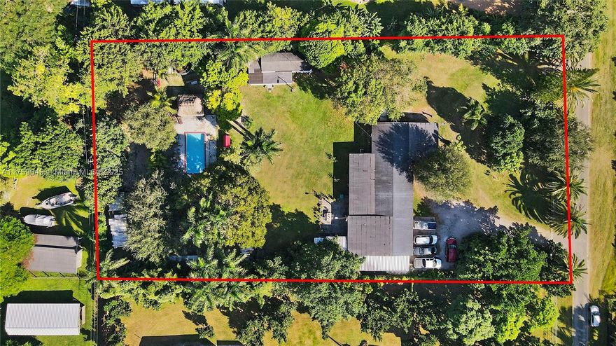 Discover this spectacular property located in the prestigious area of Redland, Florida! 1.15 acres of fenced land, this estate is perfect for those seeking space, privacy, and a connection with nature without compromising on comfort or luxury 4 spacious bedrooms and 3 full bathrooms. New air conditioning system installed in 2022.Impact-resistant windows and doors for added safety, Outdoor. Swimming pool with a relaxing lounge area. Gazebo, ideal for outdoor gatherings.3 large terraces to enjoy sunsets. Ample parking space for multiple vehicles. Storage/utility house for extra convenience. Chicken coop and a small stable, perfect for a rural lifestyle. Tall light posts to illuminate the entire property at night. The property boasts a diverse fruit tree plantation.