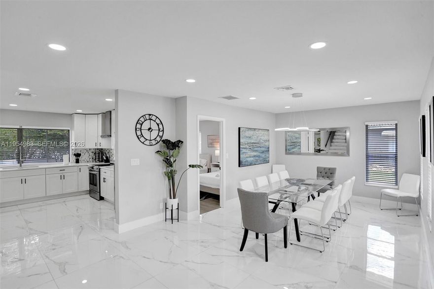 Exquisitely renovated two-story residence offering 6 bedrooms and 3 beautifully appointed bathrooms, situated on an expansive 12,000-square-foot lot in the highly desirable and private Little Harbor neighborhood of Deerfield Beach. This exceptional home features stainless steel appliances, spa-inspired marble bathrooms, and a luxurious jacuzzi. Outdoor living is elevated with a brand-new resort-style pool and an oversized deck ideal for entertaining. Enjoy tranquil water views from the second floor and the convenience of being just one mile from the beach. Completely move-in ready—an extraordinary opportunity to own a turnkey coastal retreat