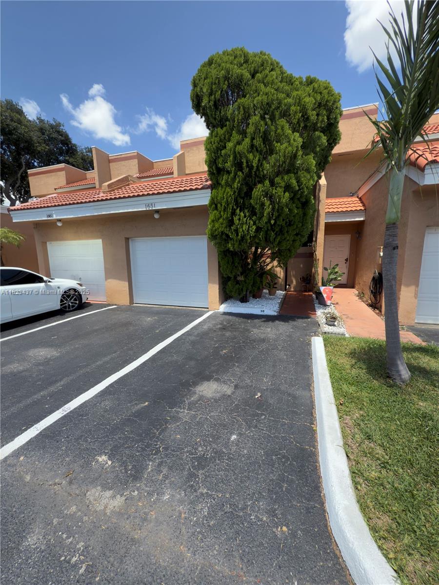 RARE FIND! Spacious 4 bedroom and 3 FULL bathroom townhouse with 1 car garage and 2 assigned parking spaces located in front of the home. Located in a quiet well-maintained community, this home offers comfort, functionality and convenience in one of Pembroke Pines most desirable areas near ALL major highways. Roof was re-done in 2023, Community offers , pool, handball court and common areas. HOA has reserves and welcomes FHA buyers. This home is ideal for families, first time-buyers or investors seeking value and location.