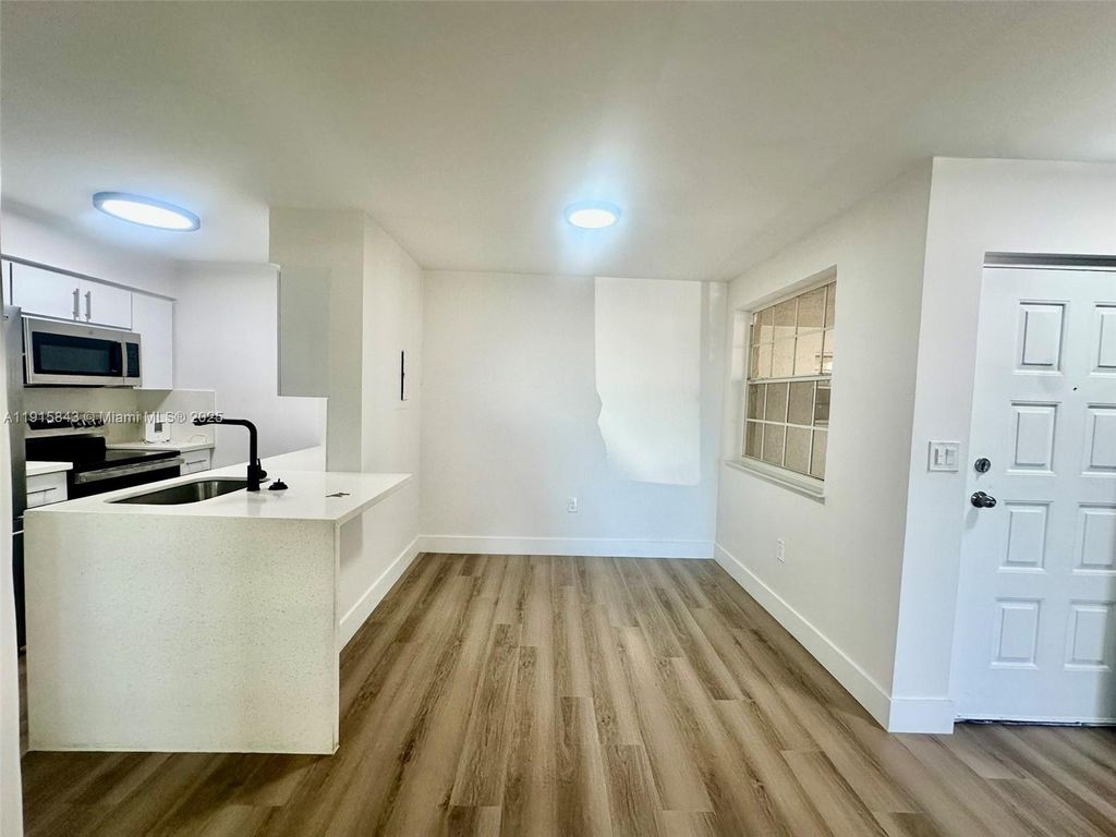 Photo of 2890 N Oakland Forest Dr #103, Oakland Park, FL 33309 (MLS # A11915843)