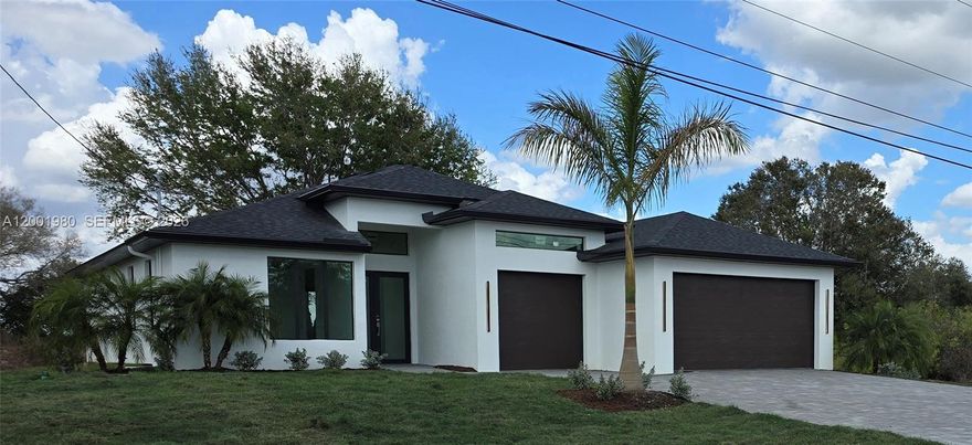 No HOA •• NO CDD •• No Flood Zone Insurance • Canal Lot • 3-CAR+ Garage • 4BR 2BA • HUGE 37 x 10 Lanai w/Kit Sink • HURRICANE RATED • QUALITY NEW CONSTRUCTION. Beautiful Modern Luxury Living at an Affordable Price.  Modern open floorplan. FEATURES: • 3rd Car 12-ft ceiling possible lift • 8ft Tall Garage Doors • Open-Concept w/ high Tray Ceilings — 24x24 Carrara porcelain flooring throughout. • Gourmet Kitchen — 8-ft x 4-ft island seats 4, Quartz Tops, premium shaker white cabinets, recessed FULL SIZE refrigerator space for a clean, built-in look. • Luxurious Baths 12x24 white tile walls, Quartz Counter-Tops w/ premium shaker white cabinetry. • 9ft Sliding Door leads to Outdoor Living Paradise — enjoy a huge 10ft x 37ft covered lanai with a built-in Sink, under-counter Refrigerator and Grille space that is perfect for entertaining. • Smart Floorplan 8-ft interior doors, large flat moldings, laundry tub cabinet, ample storage. QUALITY CONSTRUCTION: • Built with Hurricane-rated 160mph Shingles & Re-bar re-inforced Block & IMPACT Windows & Doors. • Engineered on processed, compacted, and tested fill soil—each layer vibratory rolled & verified. Don’t settle for a house that will settle. • Canal lot with extra 50 ft of lawn depth. INCLUDED: SS Appliances, designer lighting & prof landscaping. Build on your lot or ours.  Choose the Cayman Plan — The BEST in Lehigh Acres. • A Better Way To Live……Designed For Life • $10,000 Closing Costs Concession.