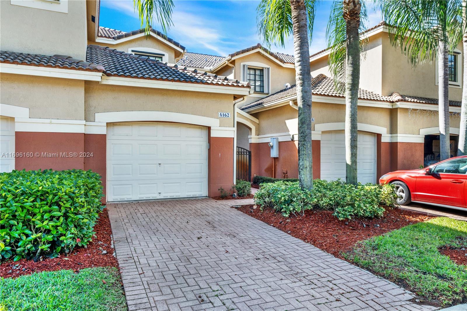 Discover the perfect first home in the gated Courtyard at the Grove in Weston! This remodeled 2-story townhome features an open-concept design, a master bedroom and junior suite with private baths, a glass-railed staircase, and a screened porch with artificial grass. Enjoy the convenience of a 1-car garage and access to community amenities, including a pool and playground. Located within walking distance to top-rated schools, the library, shops, highways, and Weston Town Center, this home combines modern style with an unbeatable location.
