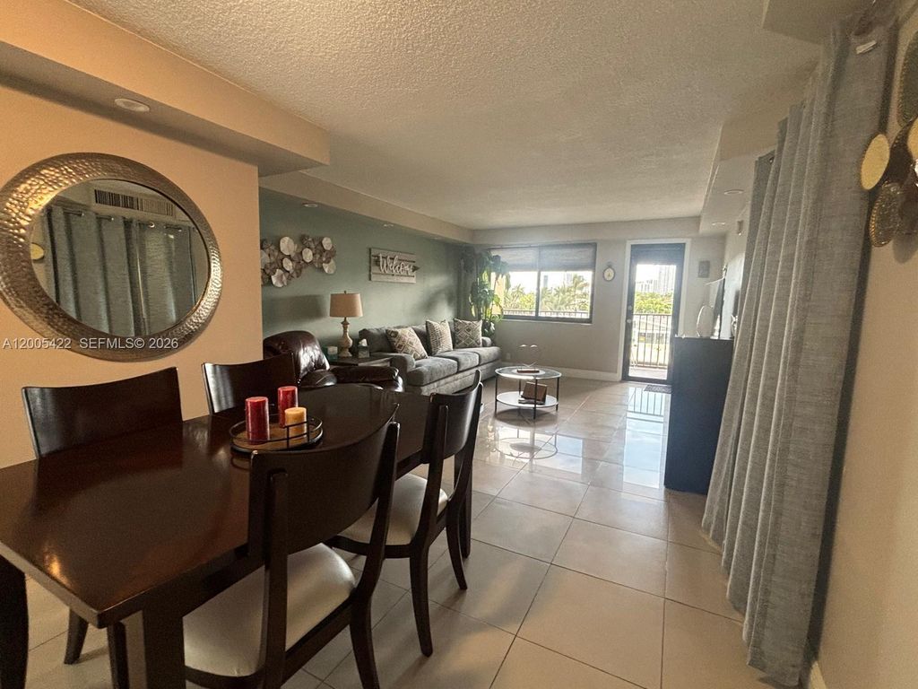 Photo of 301 Golden Isles Dr #409, Hallandale Beach, FL 33009 (MLS # A12005422)