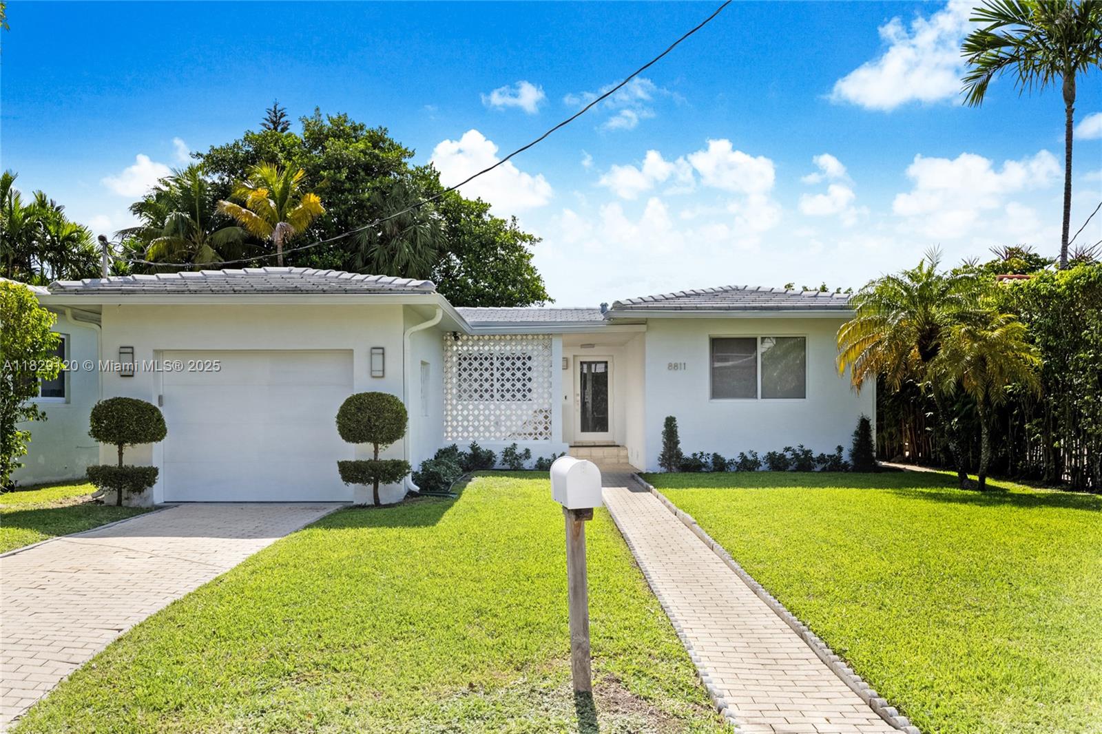 Tucked away on a quiet block in the charming oceanfront Town of Surfside, this elegant home offers 2 bedrooms, 2 baths, an oversized 1-car garage & expansion potential for a 3rd or 4th bedroom. Beautifully maintained & updated, this home features hurricane impact windows/doors, a 2014 tile roof, new electrical wiring, recessed lighting, Jenn-Air appliances, refinished solid oak floors, new interior doors, new HVAC system (2024) & high-end lighting upgrades. With years of thoughtful improvements, this home blends modern comfort with classic Surfside charm. Enjoy access to the beach, Surfside’s community center, pool, tennis courts, pickleball & playgrounds. Only a few blocks to shopping, houses of worship, Bal Harbour Shops & the Four Seasons Surf Club. Zoned for A-rated Bay Harbor schools.