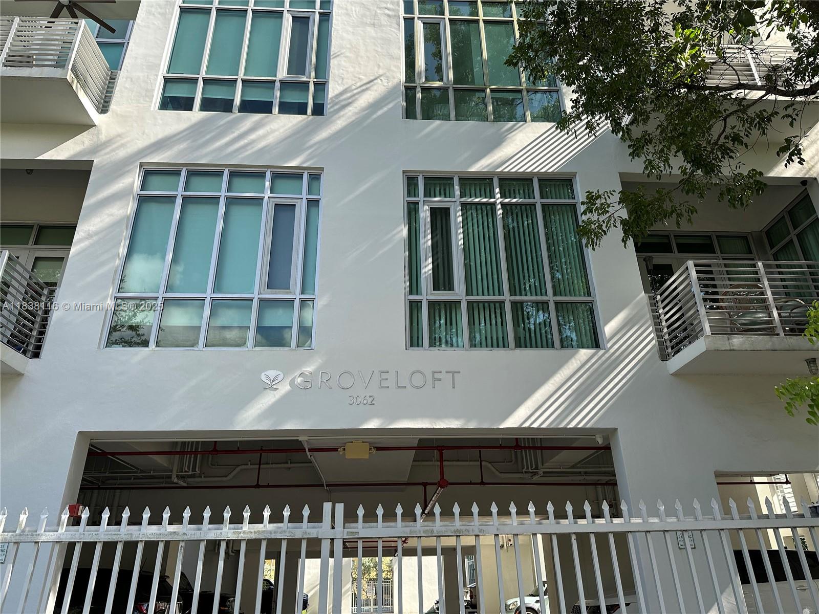 Great location in the Grove. Two level open loft style unit in condo boutique building. One bedroom and one & half bath. Remodeled Kitchen and baths. Stainless steel appliances, tile floors, high ceilings, impact windows, open floor plans. Convenient Washer & Dryer in unit. Spacious private rooftop terrace, gates assigned parking space, and community swimming pool.