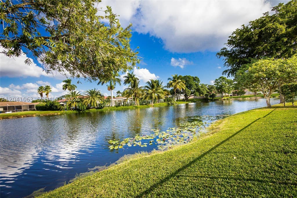 Photo of 16641 Royal Poinciana Dr, Weston, FL 33326 (MLS # A12041063)