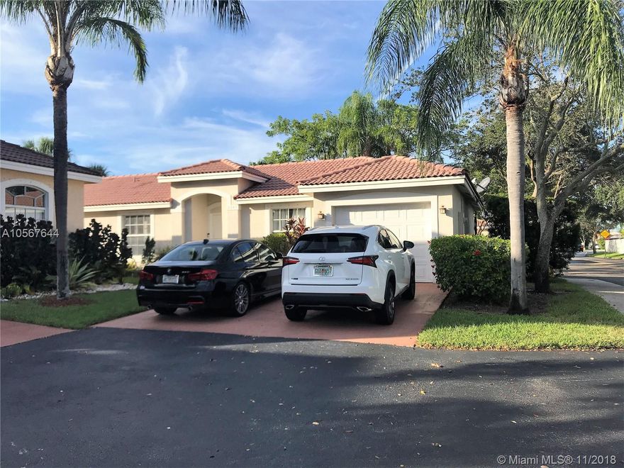 Beautiful 3/2 home with one car garage ready to go!  This lovely home sits on a corner lot & features updated kitchen with matching kitchen aid stainless steel appliances, quartz countertops & wood cabinetry all with pull out features, tile in common areas and carpeted master & guest bedroom. Granite & wood master bath with double elevated sinks as well as a recently updated guest bath.  Also included are custom wood master bedroom & guest closets, brand new water heater & Maytag washer & dryer along with a/c.  The exterior features recently paved extended patio area with lush landscaping along with shutter panels.