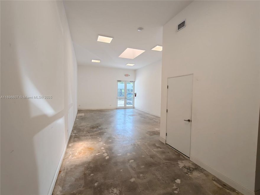 Lease 720 SF in a beautifully improved building in a rapidly gentrifying neighborhood, minutes to the Design District and Downtown Miami. Mostly Open floorplan, light and bright with skylight and glass doors, private ADA compliant restroom and separate work sink. Fully fenced and electric gate access.  Also see our listing for 3,764 SF