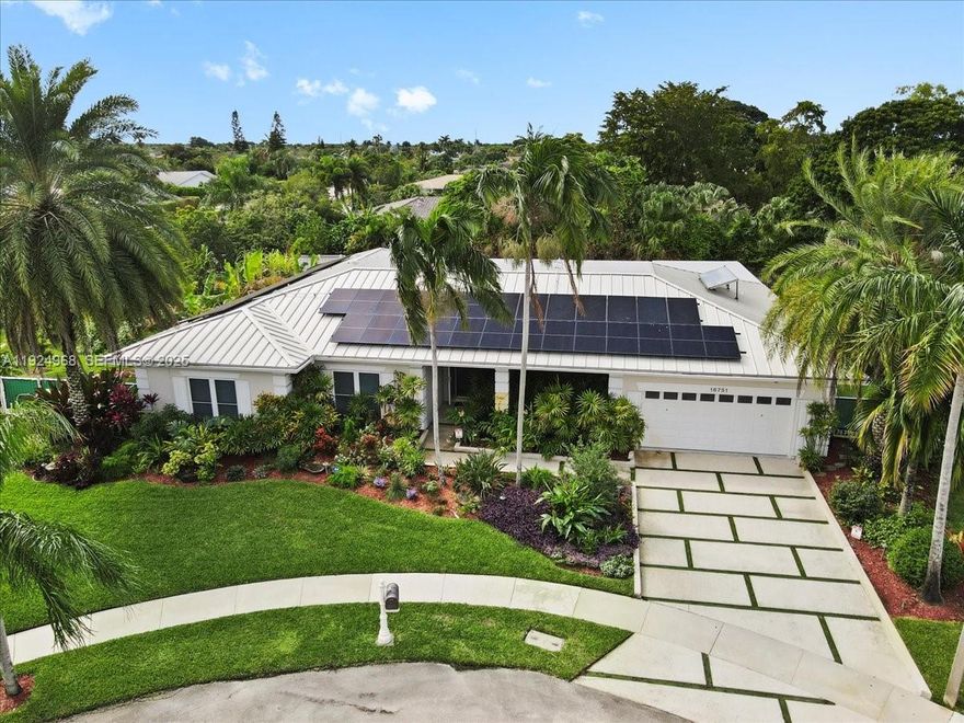 WORTH EVERY DOLLAR!!! This extensively upgraded 4 bedroom, 3 bathroom ranch-style house is situated on a private 29,548 sq. ft. pie-shaped lot, at the end of a cul-de-sac with no HOA.  Valuable recent upgrades include a metal roof (2024) that offers exceptional durability and longevity (40+ years), property fully powered by Tesla Solar panels (2024), exquisite kitchen remodel (2025) featuring elegant white double shaker cabinetry, Calacatta Quartz countertop and backsplash, brass fixtures, SS appliances-  brand new stove (2025), microwave (2025) and dishwasher (2025). Additional features include, hurricane impact windows and doors, luxurious primary bathroom, beautifully updated cabana and secondary bathrooms, entertainer's dream wet-bar and rec. room, pet-spa, cat 5 wiring, closed circuit surveillance cameras, resort-style heated pool, luxurious out-door kitchen, fruit trees, fenced-in yard, large recreational lake and much more.  $395\yr membership to Bonaventure Town Center required.