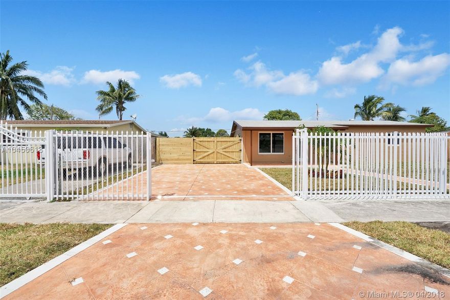 Elegantly remodeled 3 bedroom, 2 bathroom house in Ives Estates. Property offers a bright open floor plan w/impeccable features, which include: tile floors throughout, hurricane impact windows/doors, and a spacious kitchen with new stainless steel appliances and white quartz countertops. Large master bedroom with an en-suite bathroom & a private door leading to the backyard patio. The property is completely fenced in - with a private front gate that leads to the large driveway. Huge, private fenced in backyard with plenty of room for a pool. Property is close to I-95, restaurants, shopping and more. Easy to show!