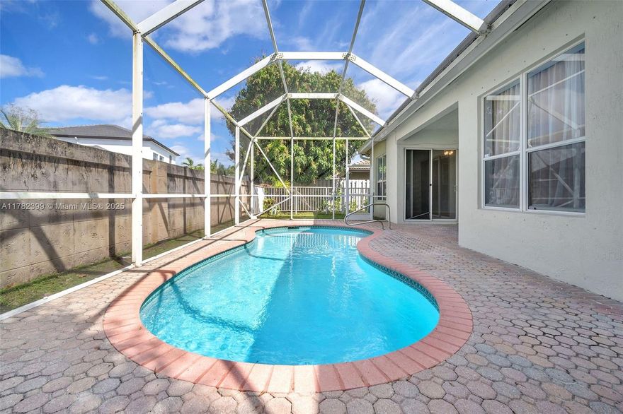 This one-story beauty nestled in 3,280 sf of upgraded living space has a new roof, new A/C,  and new stainless steel appliances 
The backyard =Resort-style pool perfection — plus 2 lush mango trees!
Inside, you’ve got 5 bedrooms, 3 full baths, porcelain floors and a huge family room plus breakfast nook, formal dining, and living area that say: Entertain here!
Got cars? There’s a 3-car garage plus a wide driveway that easily fits 3 more — and the cherry on top? You’re in the guard-gated Windsor Palms community.