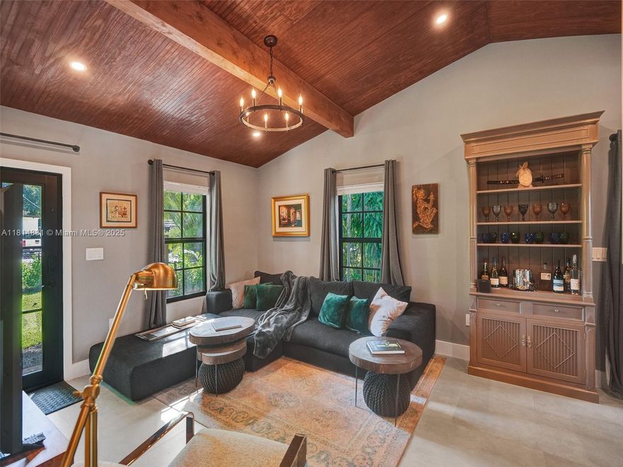 Your tropical cabin oasis awaits. Urban living w/ shops & restaurants just mins away. Surrounded by lush foliage on over 8,000 sq ft of land & over 700 sqft of wooden deck/covered pergola & outdoor BBQ make for easy outdoor living/entertainment. Including a sauna & cold plunge for your health & wellness! Remodeled 2/2, truly one of a kind, including wood beam vaulted ceilings for a cabin feel complemented perfectly w/ concrete slab tile. Impact windows & double glass door access from dining area & master bedroom allow for lots of natural light throughout. A home larger than record including a dual sink vanity in the master bath that leads out to a serene venetian-style outdoor shower. Step away from condo life and unwind in a lush tropical hideaway that feels like your own secret retreat.
