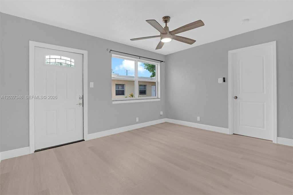 Photo of 369 Phippen Waiters Rd #1, Dania Beach, FL 33004 (MLS # A12027346)