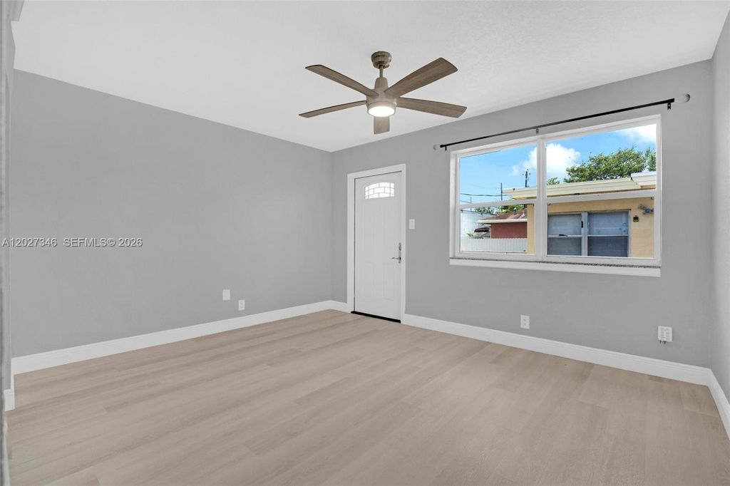 Photo of 369 Phippen Waiters Rd #1, Dania Beach, FL 33004 (MLS # A12027346)