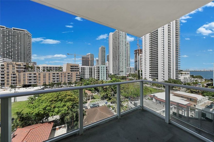 Stunning light-filled 2-bedroom, 2-bath residence at 26 Edgewater, a boutique luxury condominium in the heart of Edgewater, one of Miami’s most desirable waterfront neighborhoods. This elegant home features porcelain wood floors, floor-to-ceiling impact glass, 9-foot ceilings, premium Italian-inspired kitchen cabinetry, quartz countertops, European-style faucets, and stainless-steel appliances. A spacious balcony offers unobstructed city views with partial water views, and two assigned parking spaces provide rare convenience and added value.
The building offers a full-service boutique lifestyle with on-site management, a rooftop pool, fitness center, sundeck, and ground-floor retail. Ideally located between Wynwood, Midtown, the Design District, and Biscayne Bay, residents enjoy walkable access to shopping, dining, parks, cultural attractions, and everyday conveniences, with quick connectivity to Downtown, Brickell, and Miami Beach,this property is also an excellent investment opportunity thanks to its very low maintenance costs, which help maximize long-term returns and make ownership more efficient and affordable. In a highly desirable rental and resale market like Edgewater, this combination of location, lifestyle, and low carrying costs makes it a smart and attractive asset.