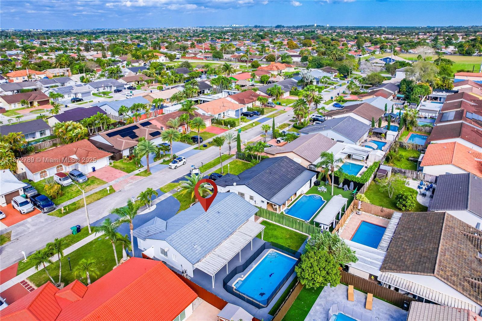 Fully renovated 3-bedroom, 2-bath home featuring a sleek modern kitchen, spacious open-concept living areas, and a private backyard with pool. The cabana bath provides easy access from the pool area, while hurricane shutters offer peace of mind. A one-car garage doubles as a laundry and utility room.
