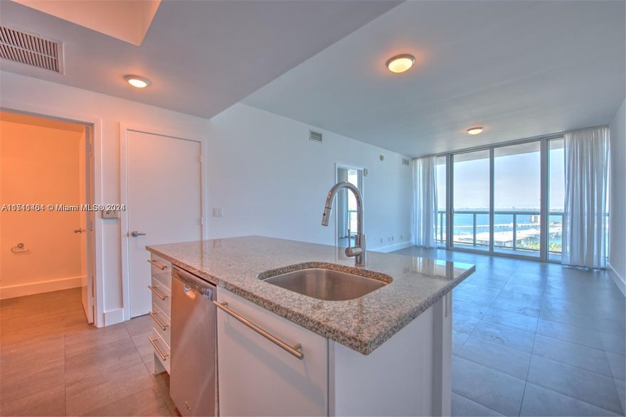 Beautiful 1 Bed/1.5 Bath condo at Marina Blue w/ 845 interior square feet, gray tiled flooring throughout, walk-in closet w/ built-in cabinets, stainless steel appliances, washer/dryer, spacious balcony, and 9-foot high ceilings with floor-to-ceiling glass windows offering breathtaking views of Biscayne Bay, Museum Park, Miami Beach skyline, and cruise ships. Rent price includes basic cable TV, water, and 1 assigned parking space. Building amenities: two swimming pools (sunset & sunrise), hot tub, fitness center, sand volleyball court, 24-hour concierge, valet parking, business center, and party room.