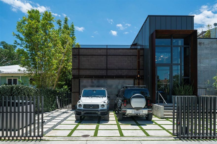 Architecturally significant modern home combined with an industrial aesthetic, perfectly fit for its dynamic neighborhood. Upon entry, a 20' high gallery greets you; highlighting a one-of-a-kind ceiling light sculpture. This house embraces its vibrant and active waterfront, integrating a 52’ boat slip with lift and a dock on each side. The home features a glass-enclosed living pavilion that brings the outside life indoors, a custom theatre, indoor/outdoor fitness deck and four bedrooms with a particularly decadent indoor-outdoor primary suite. Common and private spaces surround courtyards including a pool, koi pond, and guava shade trees. The ultimate home for the collector of unique things.