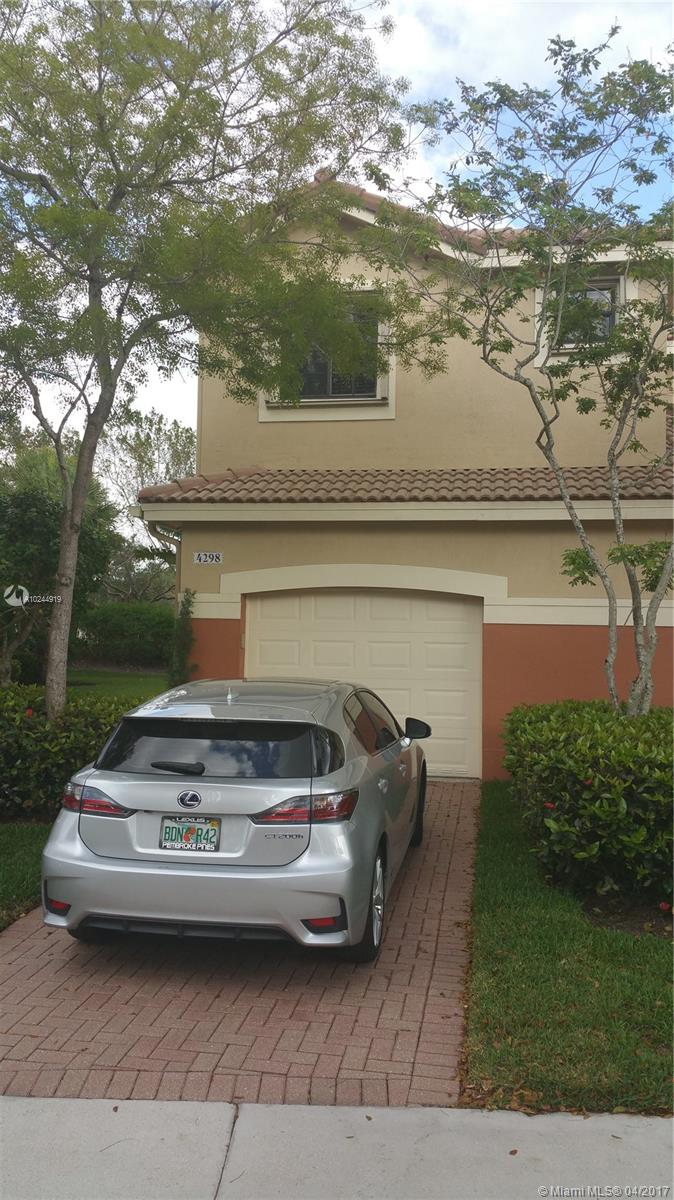 Beautiful Townhouse in The Courtyards 2 story 4 bed 2 1/2 bath updated tile and wood floors, granite tops, with S.Steel appliances and a private no neighbors behind garden view. Located next to Falcon Cove and Cypress Bay A rated middle and high schools in Weston, also the amazing Weston Public library. Hurry!! will go fast.