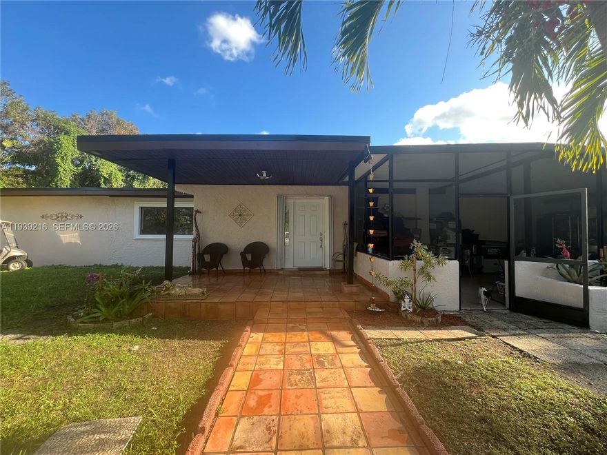 Discover a spectacular investment opportunity in the heart of Redland, conveniently located near Krome Avenue. This charming single-family home offers 2,920 square feet of living space on over an acre of land in a quiet and desirable neighborhood.  Renovated and updated, the home features a large kitchen with beautiful granite countertops, making it ideal for culinary enthusiasts. Inside, you’ll find five bedrooms and three and a half bathrooms. Each of the three additional bedrooms includes a large closet, providing ample storage space throughout the home. The master bedroom is especially spacious, featuring a huge bath and a closet designed to accommodate everyone’s needs. The property is securely enclosed by a durable galvanized metal fence, ensuring privacy and security. On the side of the property, there’s a large open area perfect for storage, projects, or a small business setup. The lot also features two different kinds of avocado trees along with mango and lychee trees, offering a delightful variety of homegrown fruit. The property included a dedicated animal shelter with some divided sections, suitable for birds, pigs, and other farm animals. The property also includes a large metal tank and additional small cement tanks, all set up and ready for fish farming or other aquaculture use.
Built with a durable brick exterior, this home combines lasting quality with charm, making it a truly exceptional find.