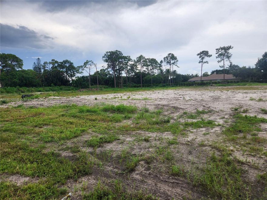 Extremely rare 3.70-acre Two parcels on private dead-end street in Lake Worth Beach. Zoned Agricultural Residential—ideal for estate, farm, or multi-home build. Two fenced parcels with canal frontage on north/east sides. Includes completed architectural plans, 400-amp panel, well water, 60'x120' 8” concrete pad for greenhouse or grow pad. Surrounded by farms and luxury homes on smaller lots. No HOA, no restrictions. With mature trees, breezes, and in the heart of city amenities. Some farm equipment and storage containers included. One of the largest privately held lots in the area—high, dry, cleared, and ready to build. Working farm, with contracts if you wish to continue. Gated and fenced.
