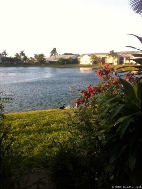 CHARMING 2/1.5 OVERLOOKING THE LAKE WITH MASTER BEDROOM LEADING OUT TO COVERED PATIO. WASHER, DRYER AND DISHWASHER