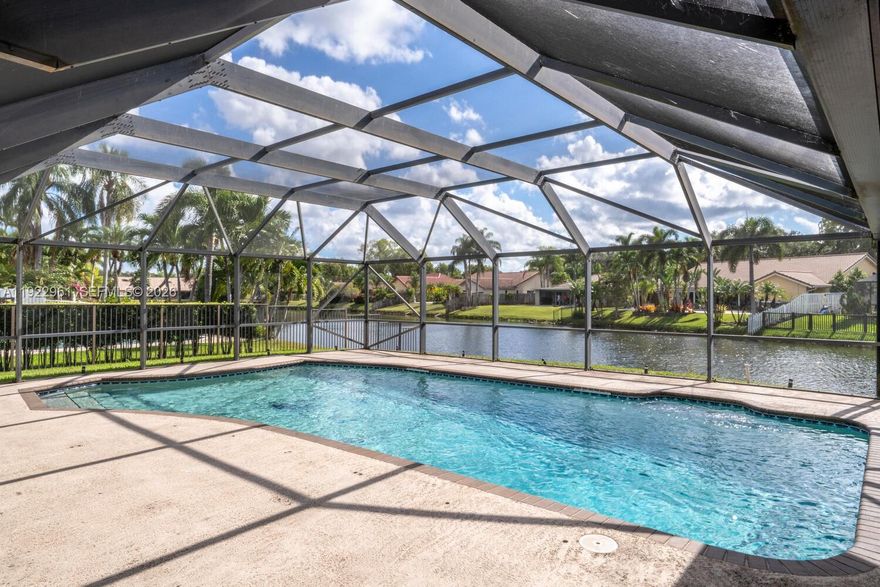 Below market, Jacaranda Lakes premium waterfront lot.  Home features single story lakefront pool home on a quiet and private cul-de-sac street. This single owner residence, built in 1987, has been well maintained and offers over 2,794 adjusted building SF on an expansive 10,399 SF oversized lot. Backyard features beautiful water views and screened in patio and pool.  Permitted & Approved Miami Dade Hurricane Shutters throughout, providing storm protection with the following upgrades: Roof 2006, water heater replaced 2021, and 3 ton AC unit in 2018. The backyard is fully enclosed with private 5 foot permitted fence. Interior home layout delivers comfort and functionality and potential for modern customization. Low HOA only $53 a month.  Jacaranda Lakes features desirable central location offers easy access to parks, schools, Sawgrass Mills, and major highways.