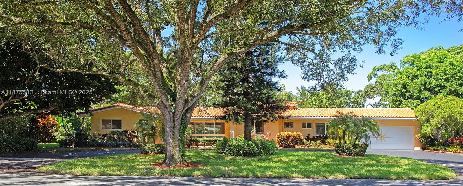 THIS IS IT! BEAUTIFUL CURB APPEAL! SPRAWLING 1-level Home, w/ OVER 3,100 sq. ft of MAIN LEVEL LIVING on an EXTRA WIDE, nearly double PRIVATE LOT! ADD a Heated POOL & XL Beautiful Patio in this Fenced & PRIVATE OASIS w/ Mature & Maintained Landscaping, AMAZING 6 FRUIT TREES (mango, avocado, lemon & more!) PLUS a Covered Outdoor Grilling Area, PERFECT FOR ENTERTAINING. INSIDE are 4 BR & 3 BA, Lg. Living RM, Dining RM, Florida RM & an add'l DEN make this home so spacious. KITCHEN has Granite Countertops & matching Table & roll-out drawer Pantry. Bedrooms have NEW CARPET & PAINT, ceiling fans & lg. closets. 4th BR is private & ideal for BR or office w/ its own full bath. WIDE CIRCULAR DRIVE & 2 CAR GARAGE. NO HOA FEES! Hurricane Windows, Security System/Cameras, Irrigation. (Virtually Staged)