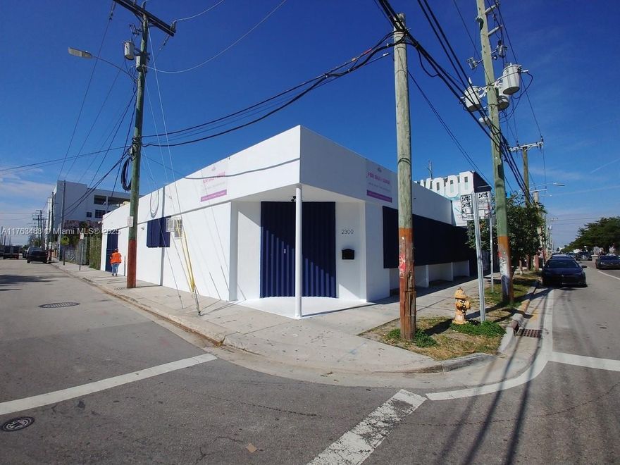 FOR SALE RENOVATED CORNER BUILDING IN THE HEART OF MIDTOWN, MIAMI WYNWOOD ART DISTRICT,GALLERY, RETAIL, SHOWROOM,. FANTASTIC EXPOSURE, 13-9"CEILINGS WITH CONCRETE T-BEAMS, SUBDIVIDED INTO 2 GALLERY STYLE SPACES, LARGE WINDOWS TO STREET, HURRICANE SHUTTERS, LARGE REAR YARD FOR PARKING/SCULPTURE GARDEN, 2 OVERHEAD DOORS, CONCRETE FLOORS THROUGHOUT.