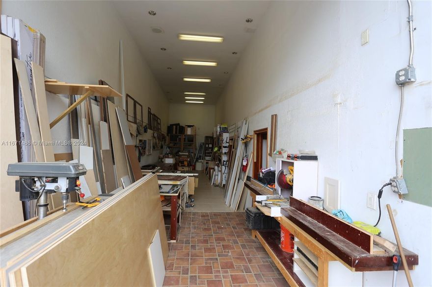 Well maintained warehouse in one of the few condominium warehouse complexes in Miami. This warehouse/shop has an air conditioned second floor office space with kitchen and two half baths, one upstairs and one downstairs.  Approximately 20 ft Ceiling height 16 Ft high bay door.