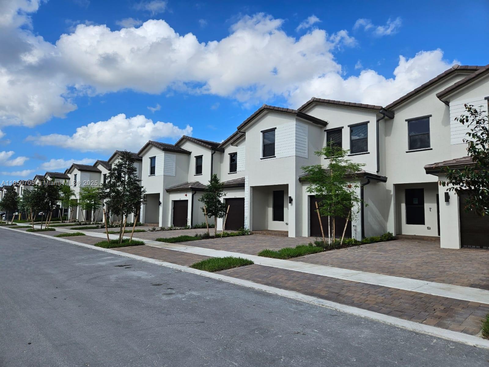 RECENTLY BUILT Gated Townhome with 1 car garage in Sunset Pines by Lennar. On the first floor there is combination of a large living and dining room, a luxurious modern kitchen with quartz countertops, top of the line SS appliances. A great Room opens onto an enclosed patio. On the 2nd floor there are 3 bedrooms. The primary bedroom is very spacious with tray ceiling and large walk-in closet. Large primary bathroom with dual sinks and oversized shower. Laundry room. White wooden blinds installed thru out. Ceiling fans and lights will be installed prior to move in. Located minutes away from I-75. Easy access to both Fort Lauderdale and Miami. Walking distance to new shopping complex. Supermarket, restaurant, gym, banking, entertainment etc. Low Move in cost