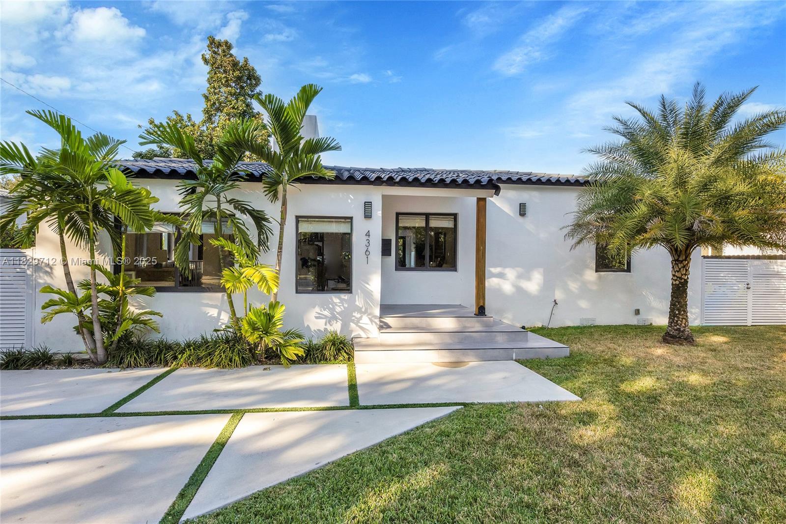 On an idyllic neighborhood block that borders Coral Gables and Little Gables, this charming and renovated home is perfectly located. Enjoy proximity and walkability to shopping, entertainment, dining, golf courses, and country clubs. When you step inside, you’ll find thoughtful design features like a foyer with wood accent wall concealing entry into a bedroom with en suite bath, updated bathrooms, and an open floor plan with sleek kitchen with counter seating and a French door to the large wood deck and expansive yard with room for a pool. This home offers great curb appeal, too, with a mature clusia hedge and modern, generous driveway. Impact windows and doors throughout. Don’t miss this rare opportunity to get a well-designed home in a central location for under $1M!