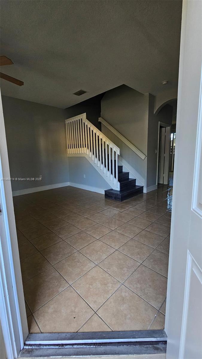 Freshly painted 3-bedroom, 2.5-bath townhome located in a cozy, gated community.! This well-maintained property is move-in ready and ideal for a new family. It features tile floors downstairs and laminate on second floor, an open kitchen with granite countertops, and plenty of storage space. Master suite includes a walk-in closet. The laundry room and a large additional storage area are conveniently located upstairs. High Impact windows for your peace of mind. The community that is beautifully maintained. Amenities include a sparkling pool and there is parking right in front of the unit. Two sheds in the backyard for additional storage. Excellent location between Florida turnpike and I 95. ***Vacant and easy to show***