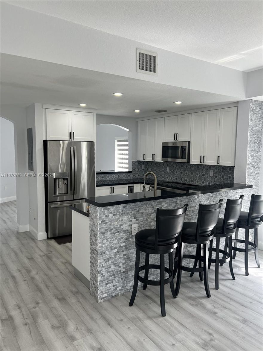 CENTURY PARC TOWNHOME COMPLETELY RENOVATED. QUALITY THROUGHOUT AWESOME FLOOR PLAN COMFORTABLE AND GORGEOUS IT BELONGS IN A MAGAZINE.ENTERTAINING IS A MUST FOR THIS HOME. KITCHEN IS A DREAM, IDEAL FOR THE CHEF OF THE HOUSE.ELECTRIC GRILL AS WELL AS A WINE COOLER AND EXCELLENT APPLIANCES, AND OPEN TO THE FAMILYROOM , BAR SITS FOUR.QUALITY WOOD FLOORING FLOWS BEAUTIFULLY THROUGHOUT AND YOU  HAVE A DOWNSTAIRS EXTRA ROOM FOR ANY NEED WEATHER ITS FOR WORK, PLAYROOM FOR THE KIDS OR THE IN-LAWS VISITING. BUILDING IS UNDERGOING NEW ROOF AND EXTERIOR PAINTING ALREADY PAID AND COMPLETION IS APRIL 30, 2026. NO SPECIAL ASSESSMENTS